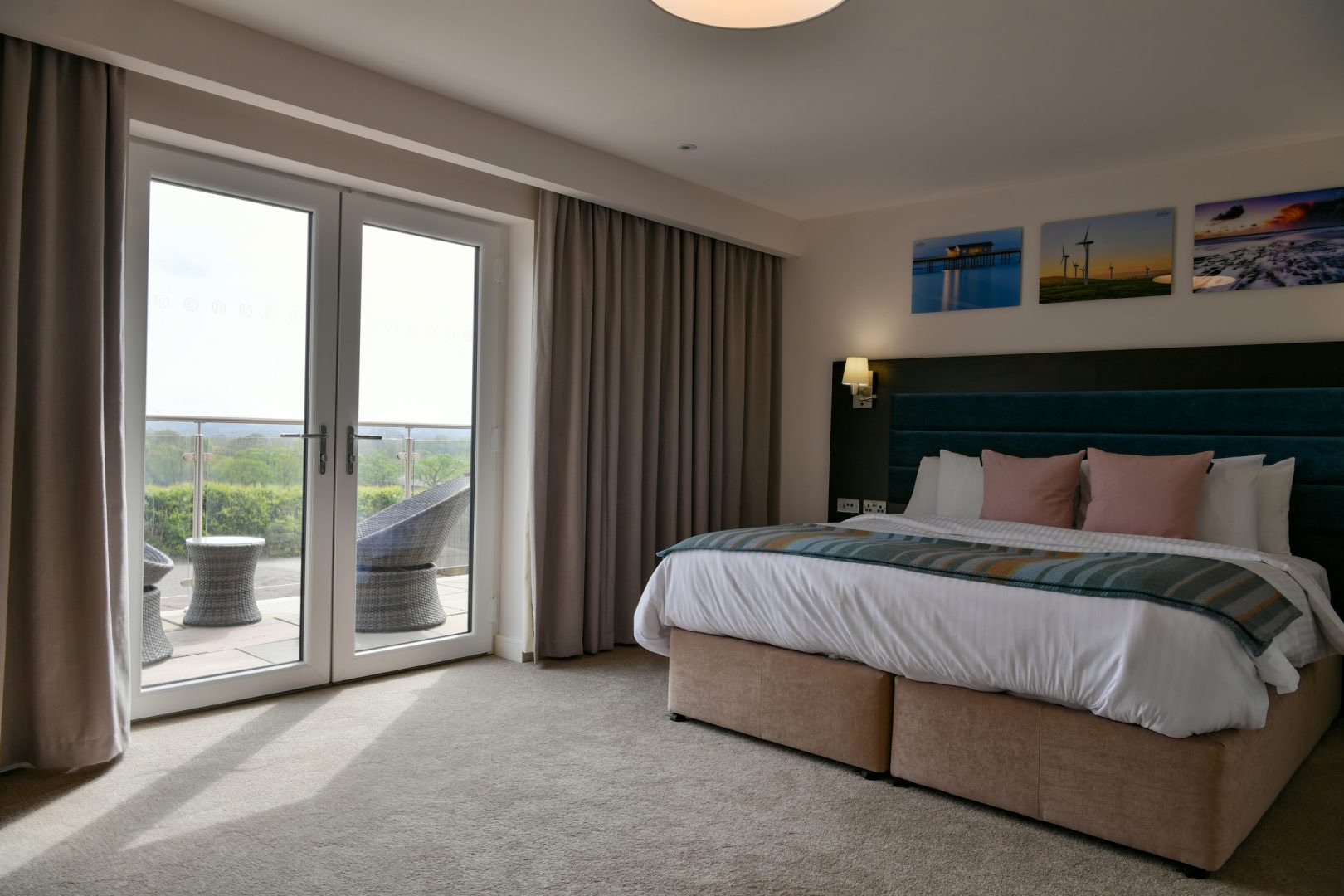 White french doors opening onto a balcony from a bedroom