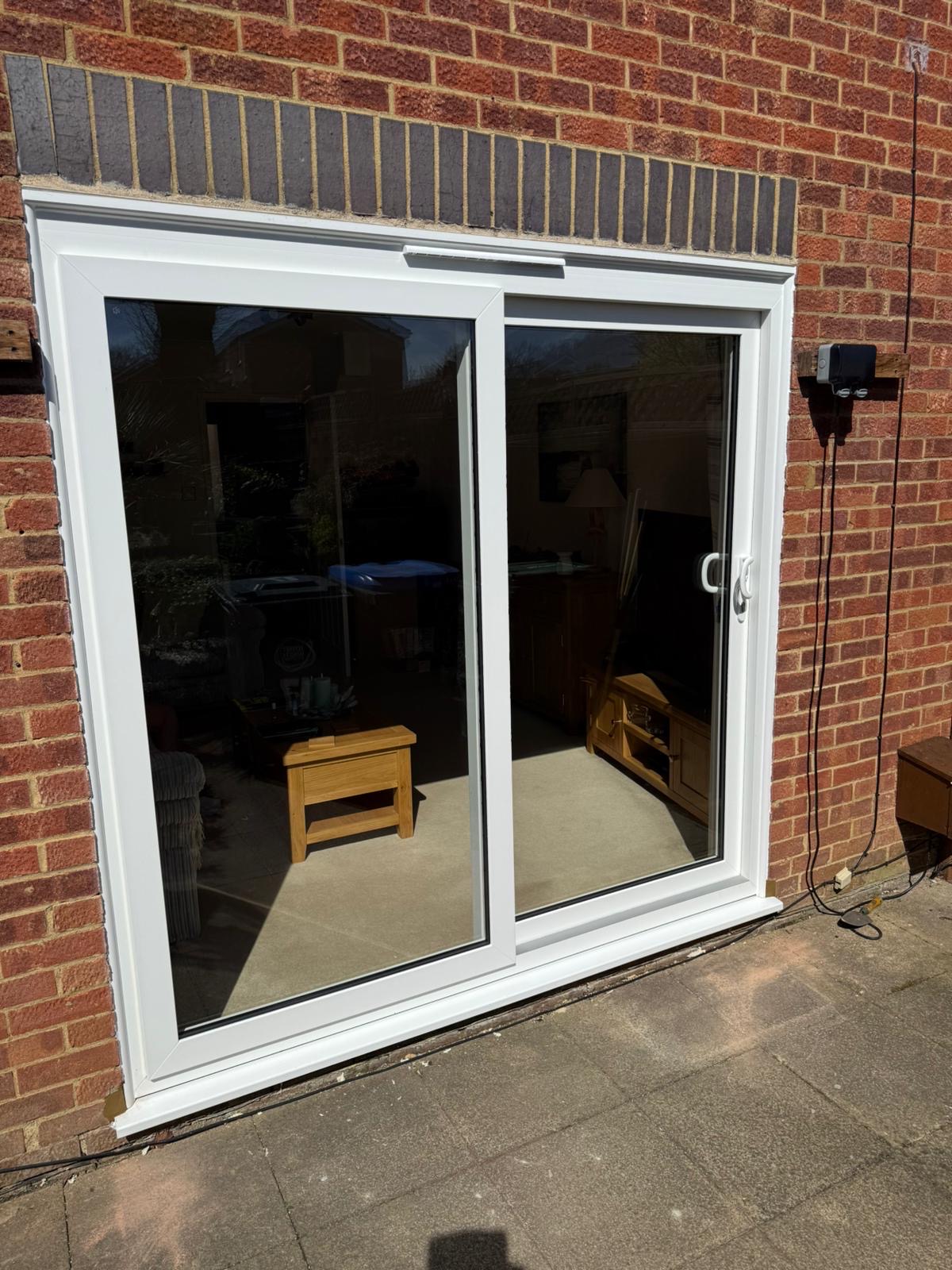 White sliding patio door viewed from the garden