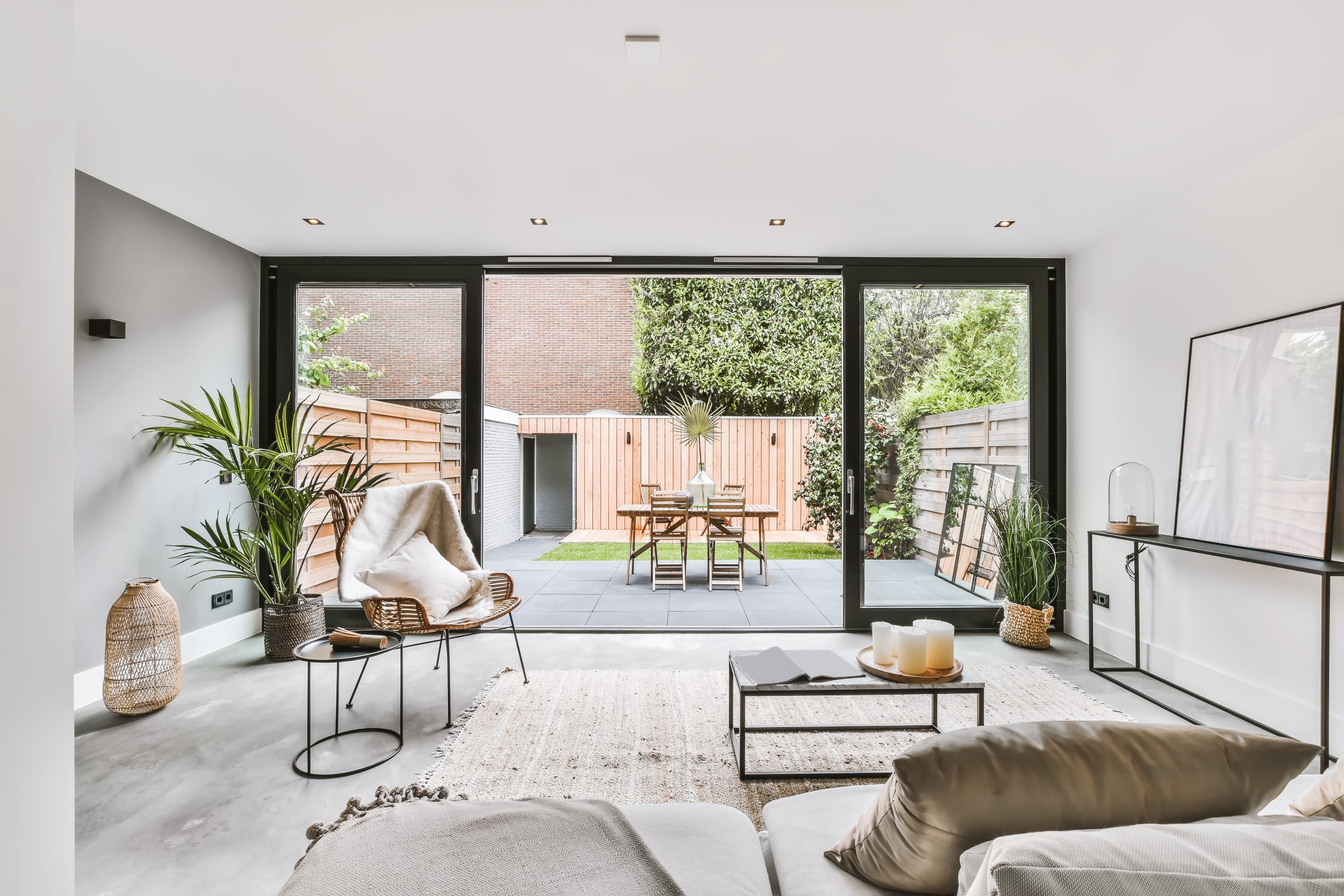 Contemporary living room with sliding patio doors to garden