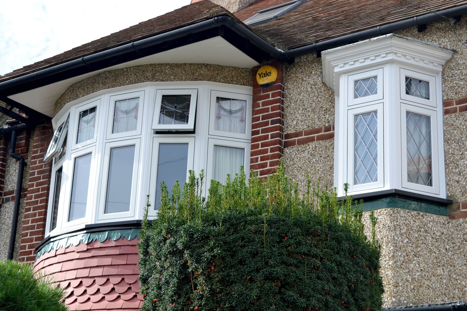 White UPVC flush casement bay window exterior